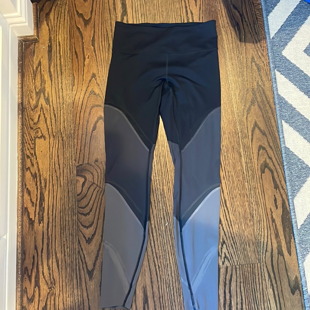 Lululemon fast and free leggings. Black and grey color lock leggings with mesh